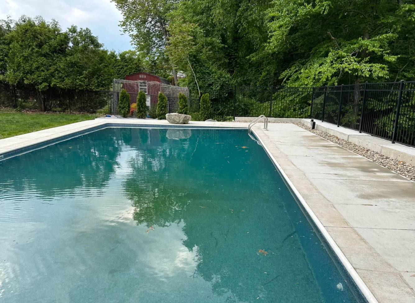 Reddit post discussing issues with installing a backyard pool, showing a rectangular pool surrounded by a fence and patio