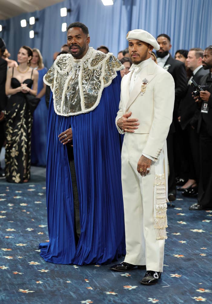 Colman Domingo successful a bluish cape and Lewis Hamilton successful a achromatic suit astatine the Met