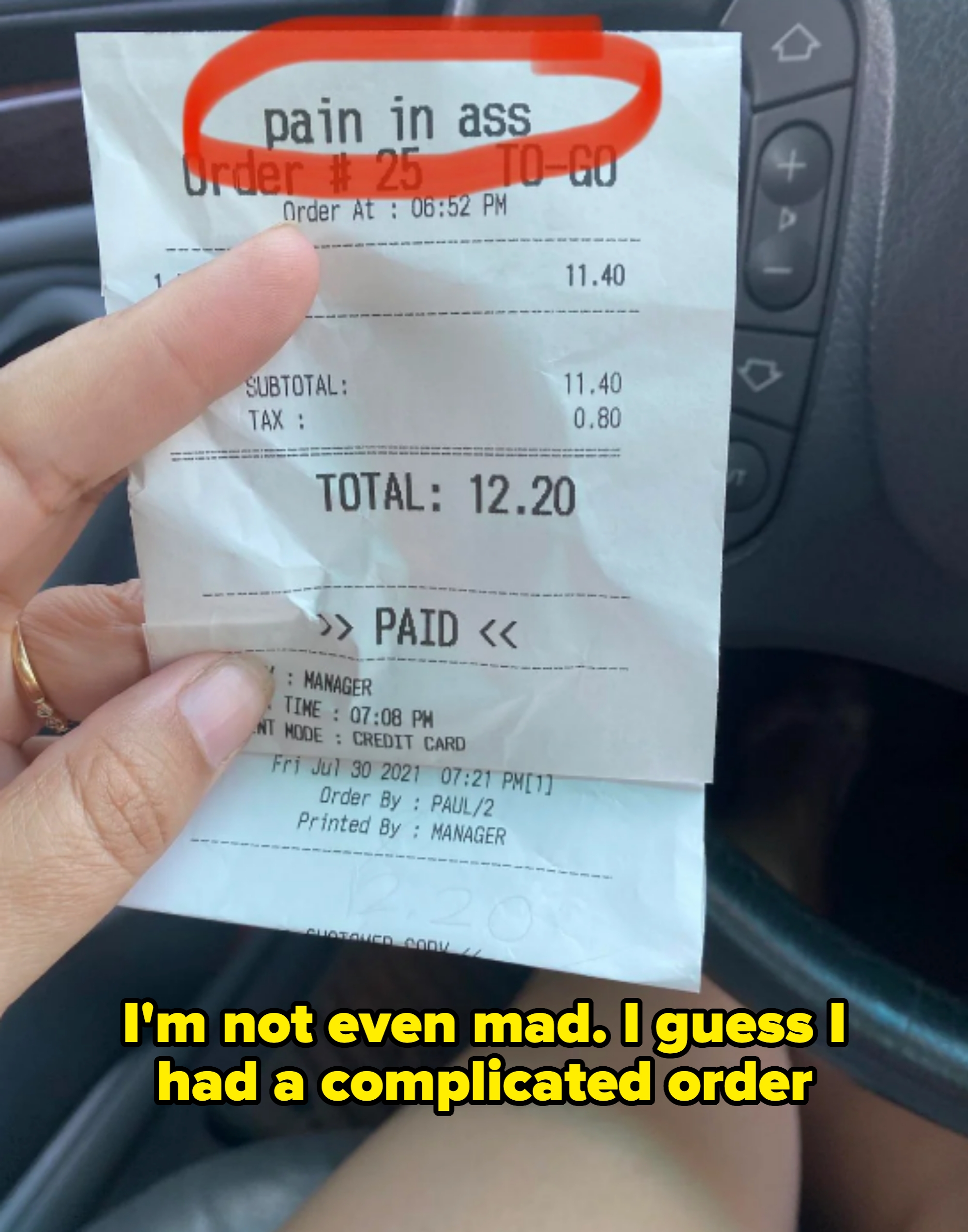 Receipt showing a restaurant order with text at the top circled in red that humorously reads "pain in ass." Caption: "I'm not even mad. I guess I had a complicated order"