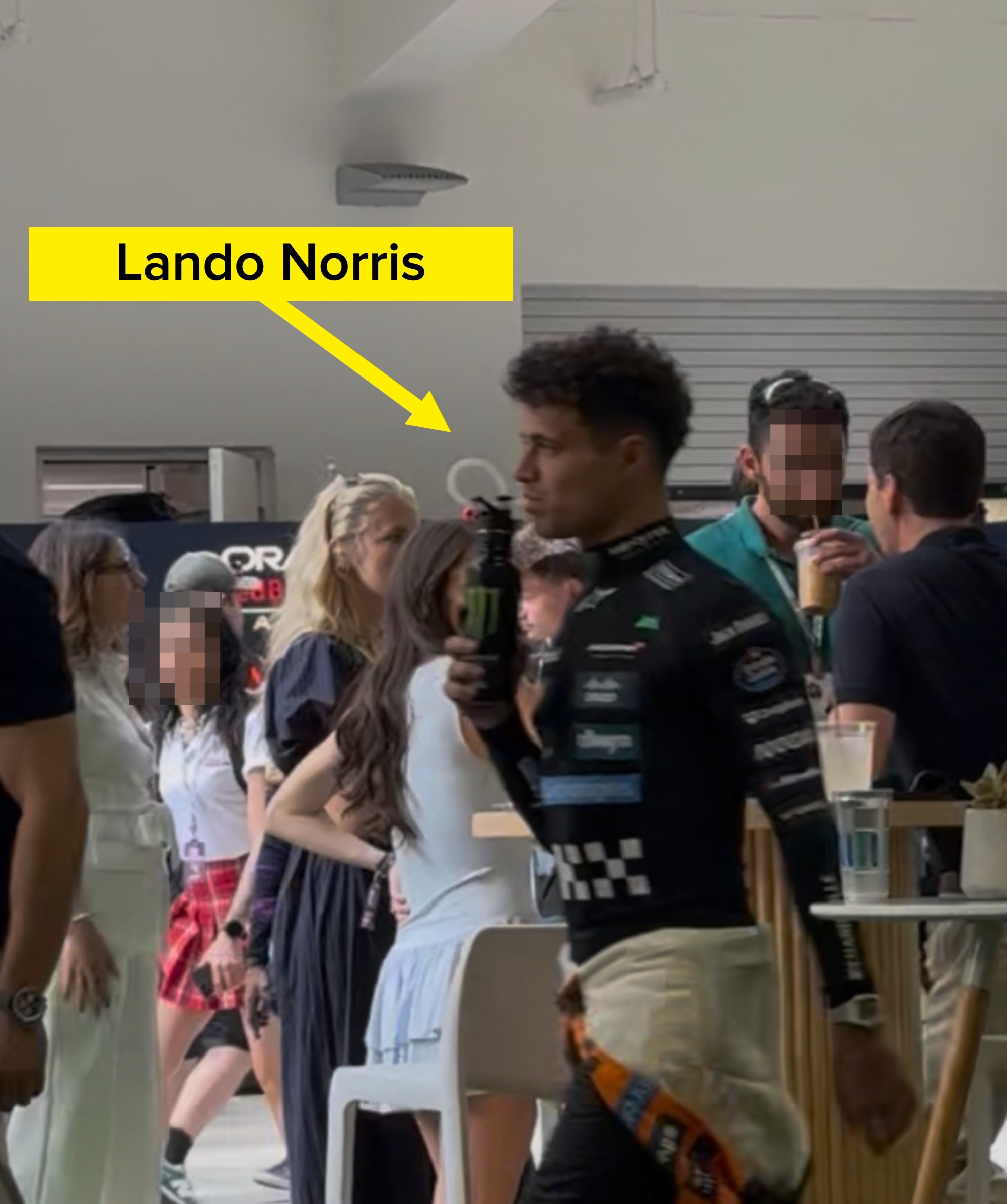 People socializing in a busy, modern airport terminal