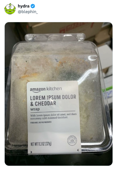 Container labeled &quot;Lorem Ipsum Dolor &amp;amp; Cheddar Wrap&quot; from Amazon Kitchen, positioned on a countertop