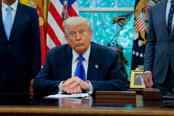 U.S. President Donald Trump takes a question from a reporter in the Oval Office at the White House