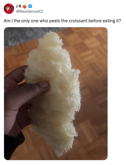Hand holding peeled croissant, tweet text reads: &quot;Am I the only one who peels the croissant before eating it?&quot;