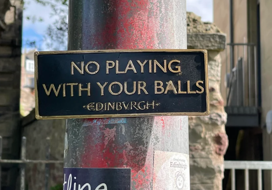 Sign on a post says, "No playing with your balls, Edinburgh."