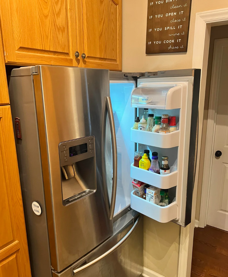 Screenshot of a Reddit post discussing a French door refrigerator in a small space. The post seeks advice on refrigerator door clearance issues