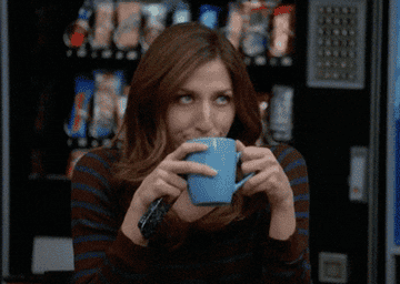 Woman rolling her eyes while holding a cup of coffee in "Brooklyn Nine-Nine."