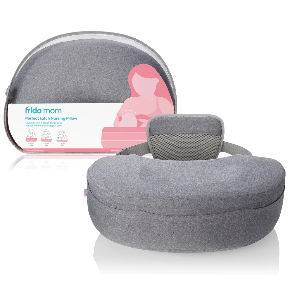 Frida Mom Perfect Latch Nursing Pillow on display. Gray pillow with ergonomic design and mesh back support, boxed version in background