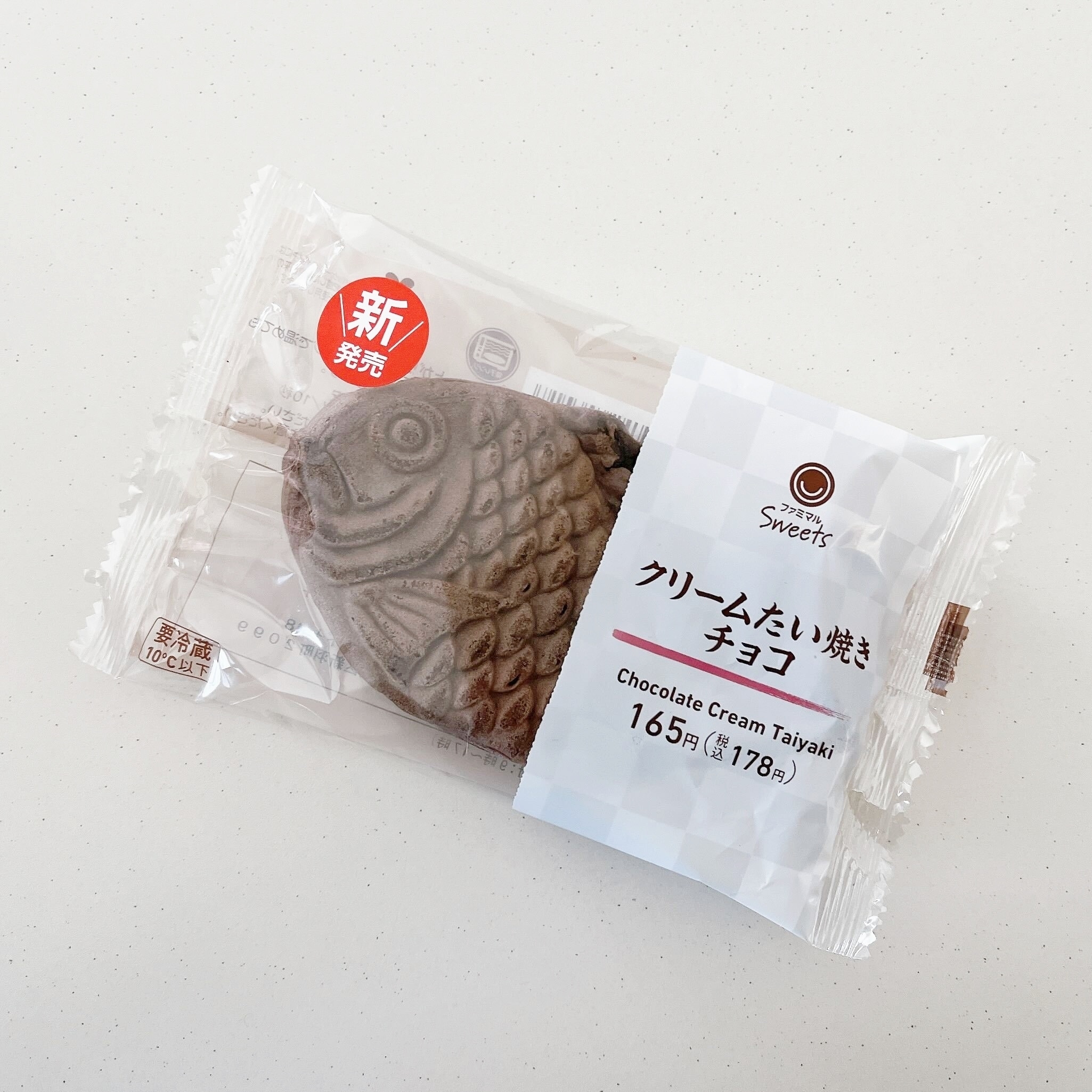 パッケージに入ったチョコクリームたい焼き。新発売と表示されています。価格は165円(税別)。