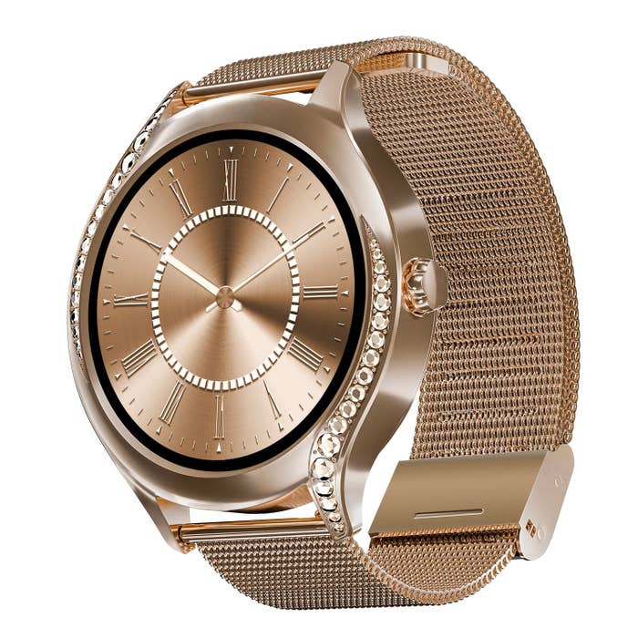 Elegant gold wristwatch with a mesh band and crystal embellishments on the case, featuring Roman numerals on the dial