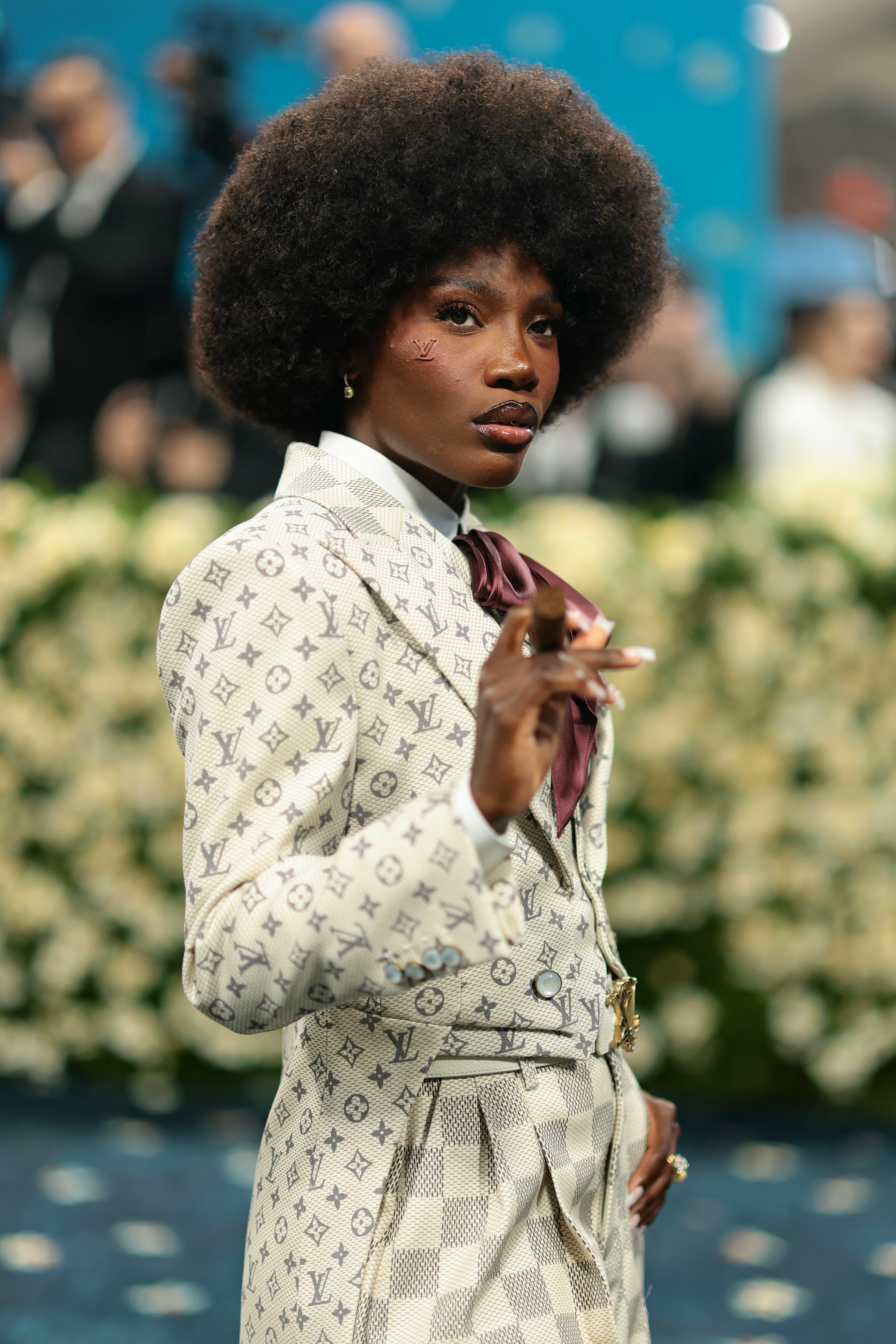 Doechii in a tailored suit with designer monogram at the Met Gala