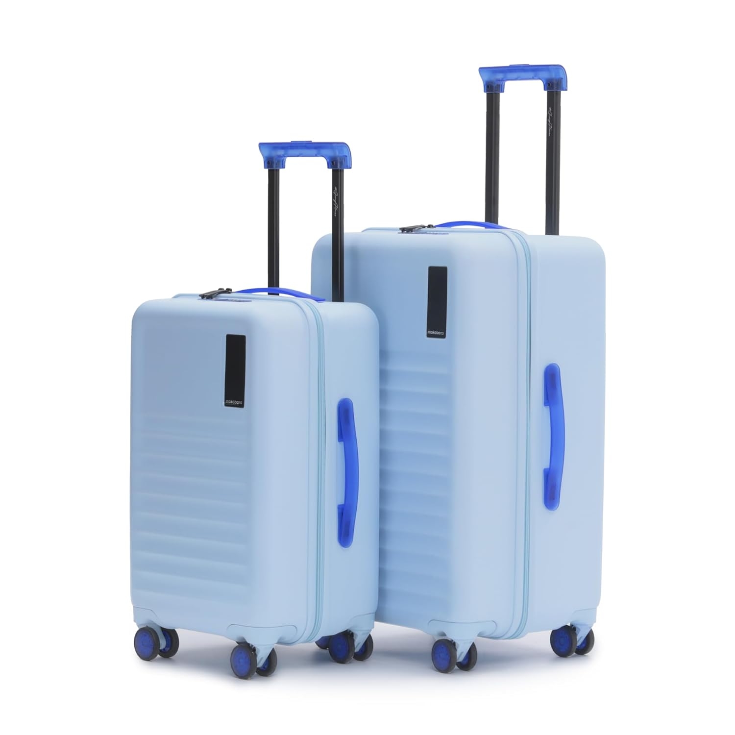 Two pieces of hard-shell luggage with telescoping handles and spinner wheels, positioned upright
