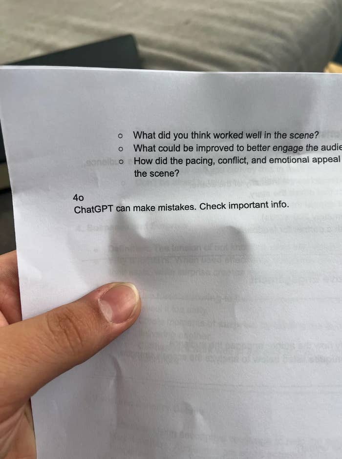 A person's hand holds a paper showing text about evaluating a scene and a reminder that ChatGPT can make mistakes