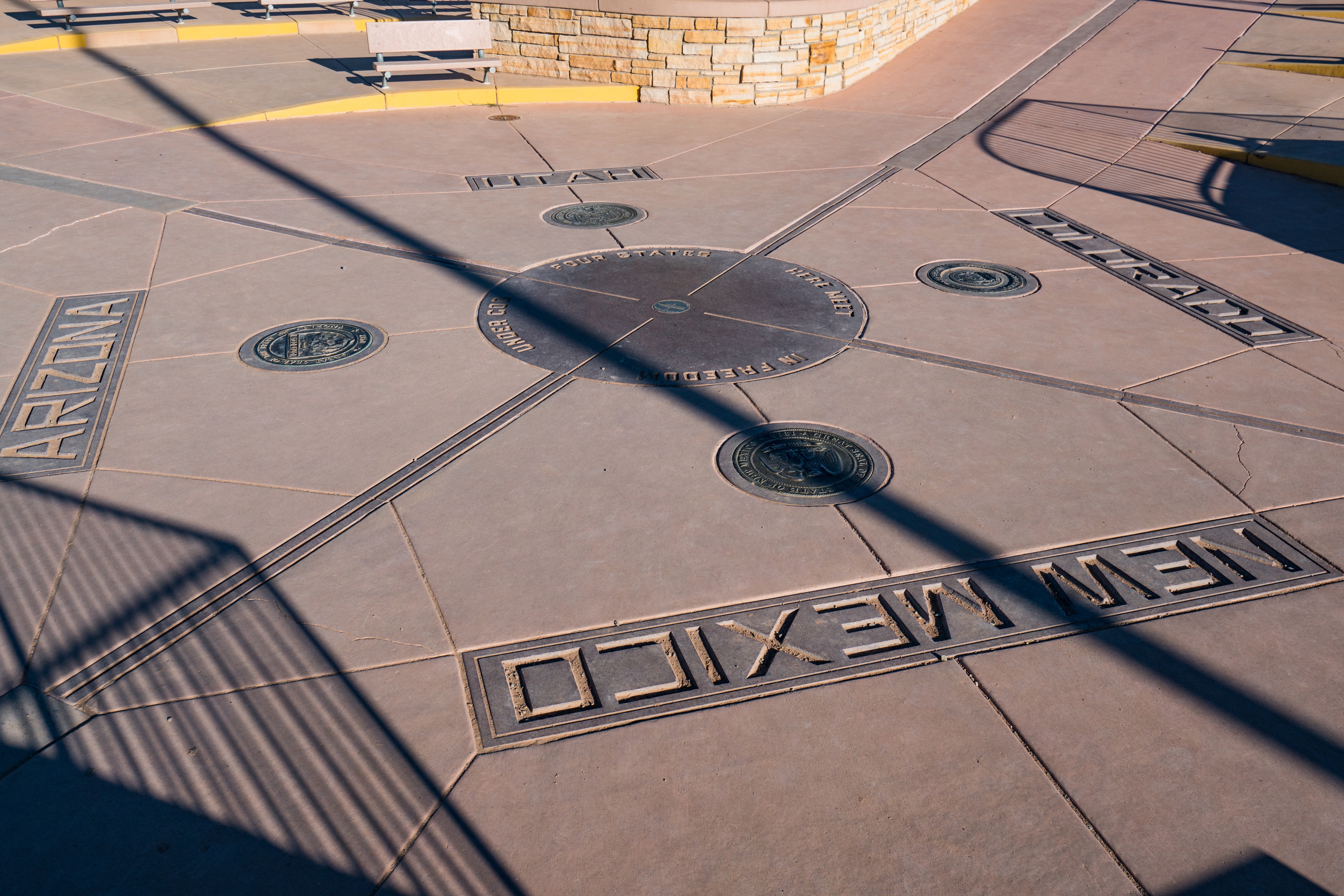Four Corners Monument showing state borders of Arizona, Colorado, Utah, and New Mexico, a popular travel landmark