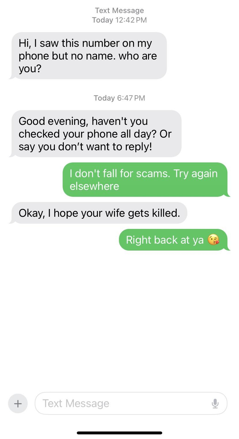 Text conversation where a person warns about scams, receives a threat, and responds lightheartedly with "Right back at ya" and a kissing emoji