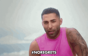 Person in sleeveless shirt with arm tattoos speaking animatedly, hashtag "#NOREGRETS" at bottom