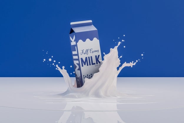 Milk carton splashes into liquid, creating a wave-like effect. The carton is labeled "Full Cream Milk."