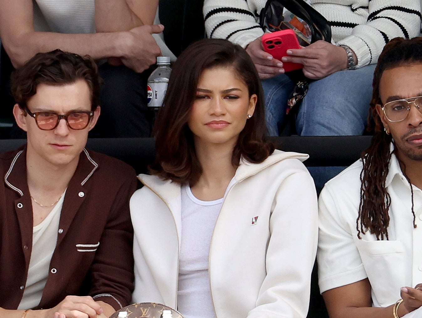 Zendaya and Tom Holland watching tennis