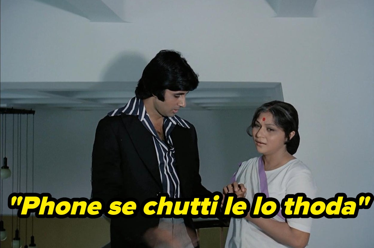 A man in a suit and a woman in a sari speak indoors. Subtitled text reads: "Phone se chhutti le lo thoda."