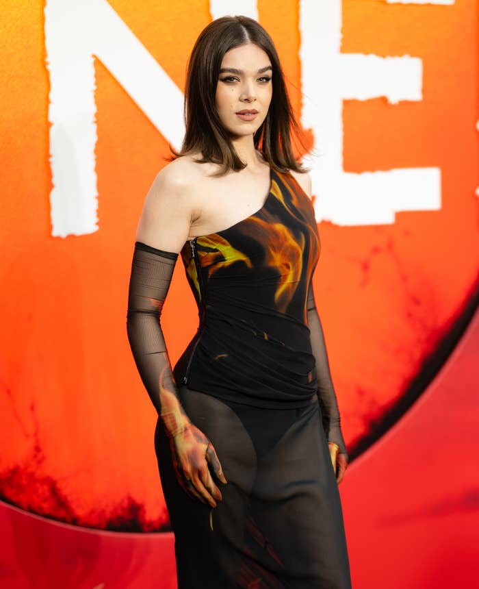 Hailee Steinfeld at a formal event, posing confidently