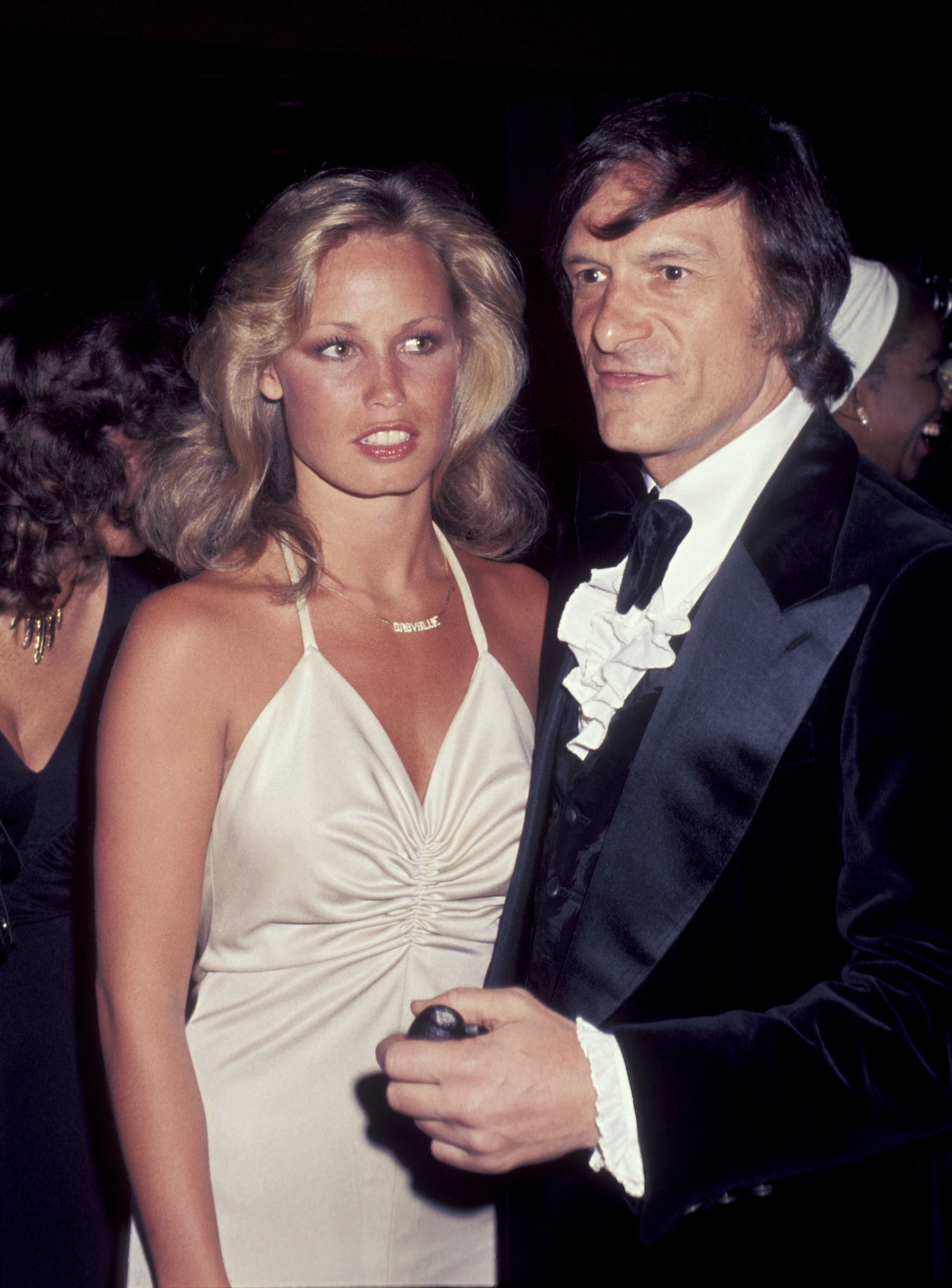 Young Sondra Theodore and Hugh Hefner at a party