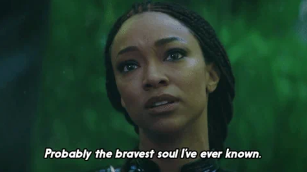 A person with a serious expression and braided hair, with text reading, "Probably the bravest soul I've ever known."