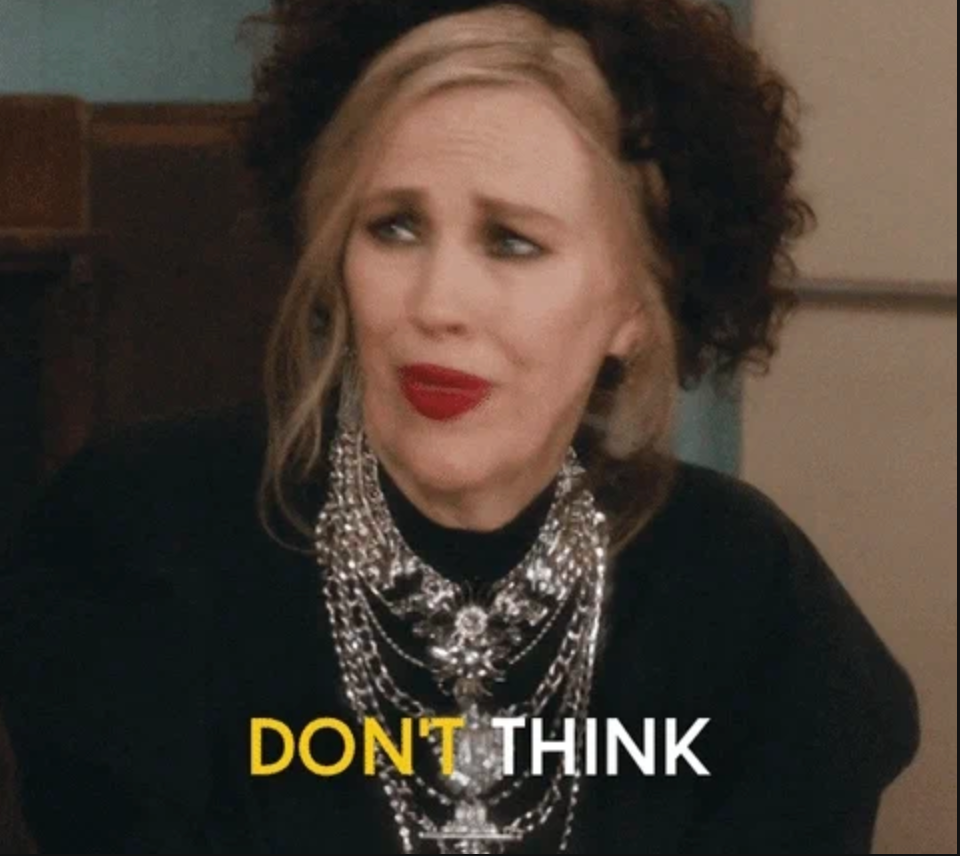 Person making an expressive face, wearing elaborate layered necklaces. Text on image: "Don't think."