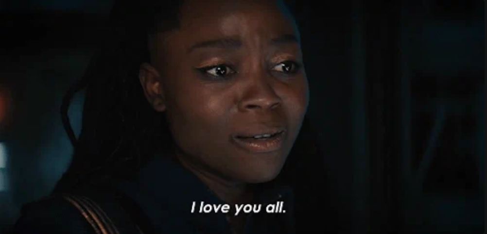 A person with an emotional expression says, "I love you all."