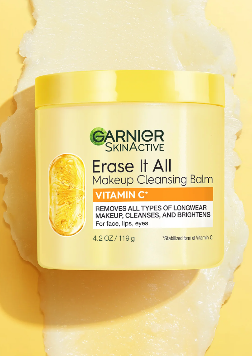Jar of Garnier SkinActive Vitamin C cleansing balm on a textured surface, highlighting its makeup removal and brightening abilities.
