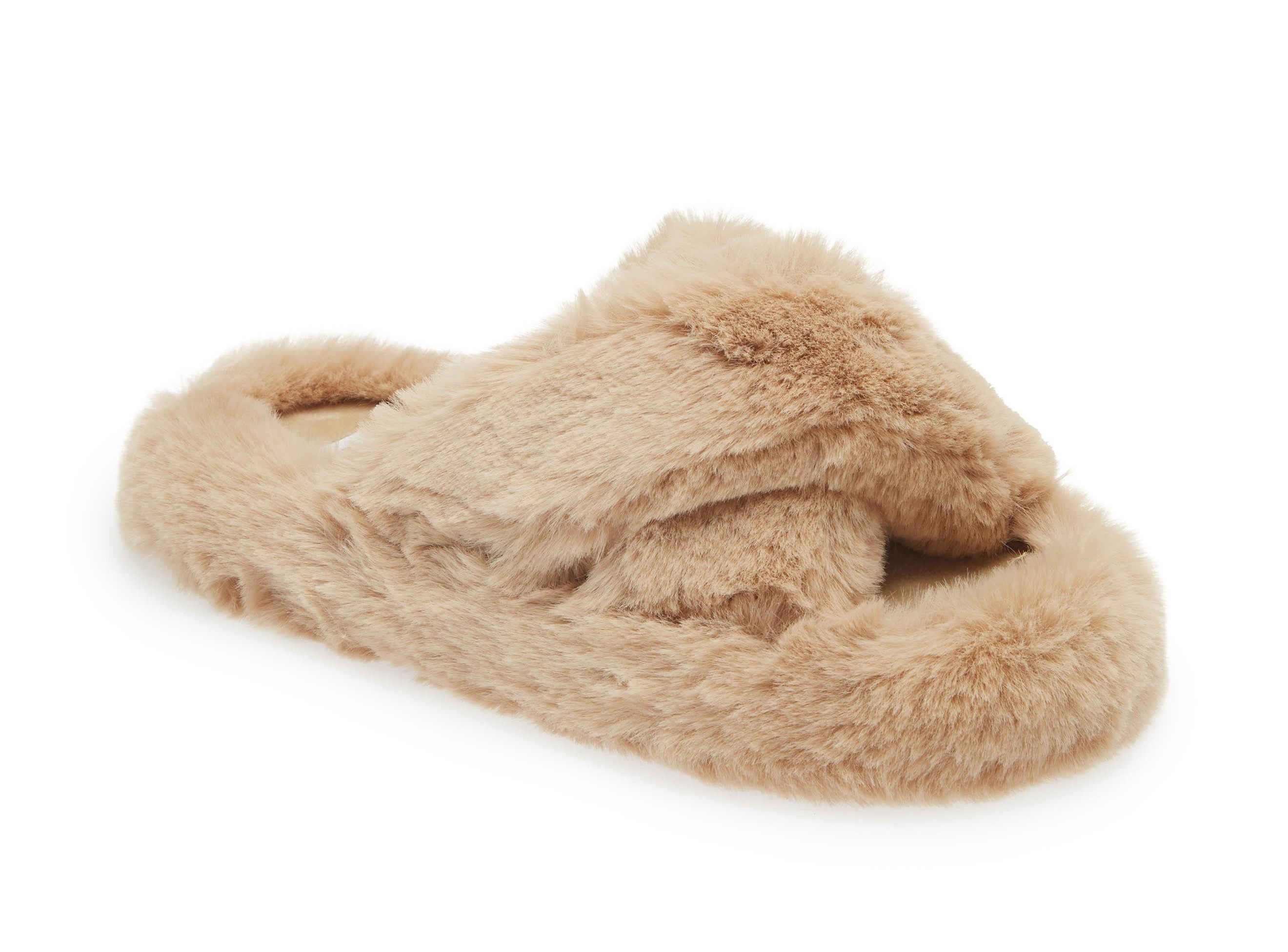 Fuzzy slipper with crisscross straps, ideal for cozy, indoor wear. Featured in a shopping article