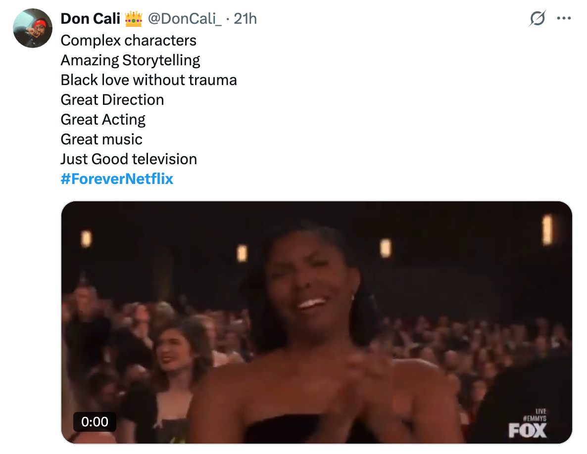 A person clapping joyfully in an audience at an event. Tweet praising a TV show for its storytelling, direction, and music with the hashtag #ForeverNetflix