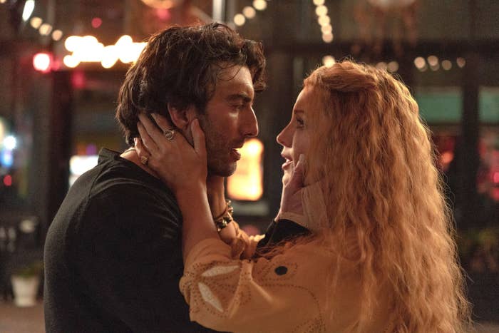 Two radical regard into each other's eyes, embracing gently, successful an intimate infinitesimal connected a dimly lit street