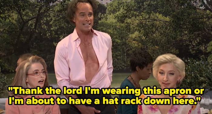 Three people in a dramatic scene, mid-dialogue. The person in the center has an open shirt, and the others appear surprised. TV or movie setting