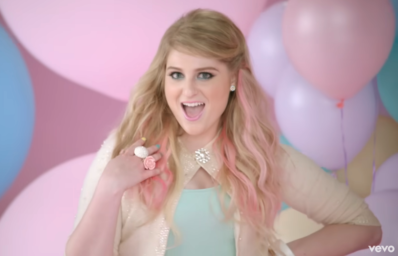 Meghan Trainor smiling in the "All About That Bass" music video