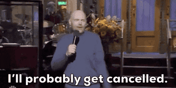 Person on stage holding a microphone, with text: &quot;I'll probably get cancelled.&quot; Background shows musical equipment and doors