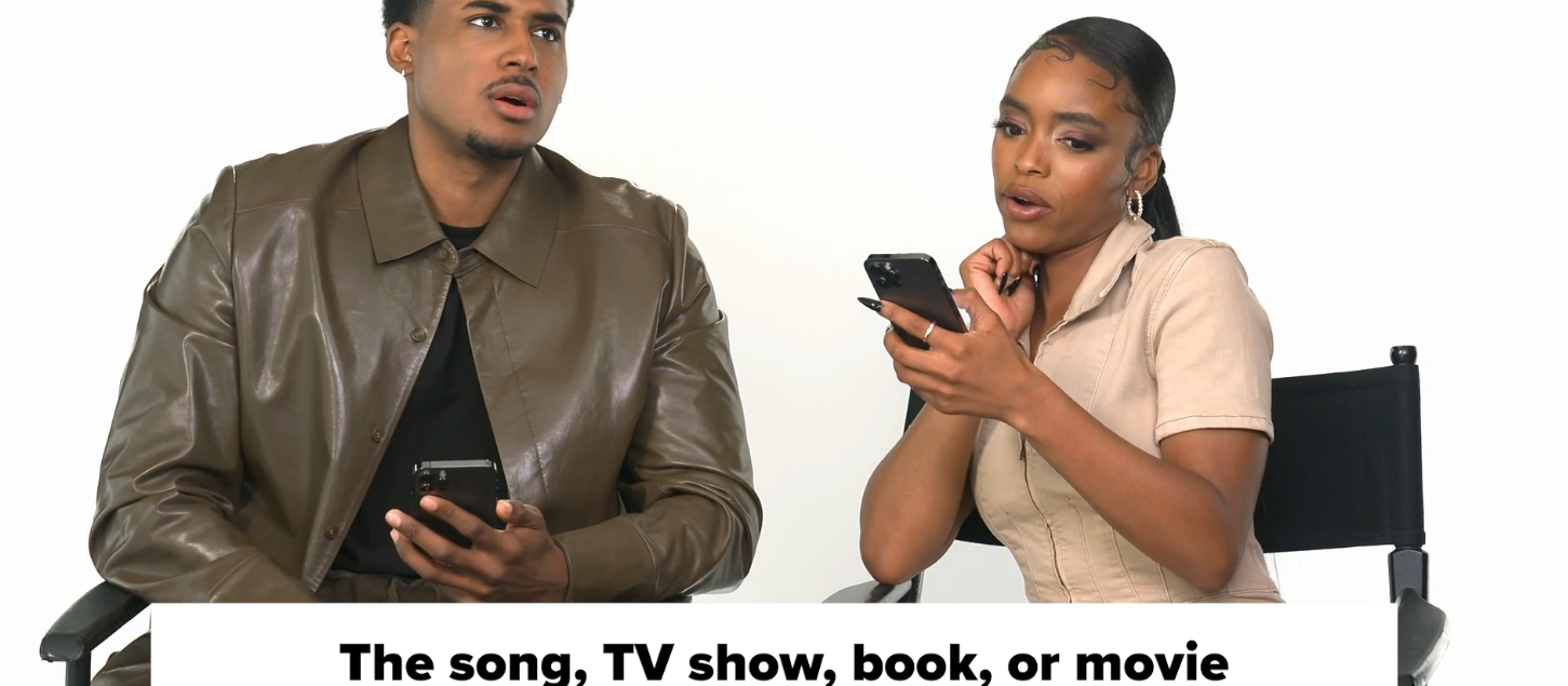 Two people sitting, holding smartphones, discussing their favorite song, TV show, book, or movie passionately during an interview