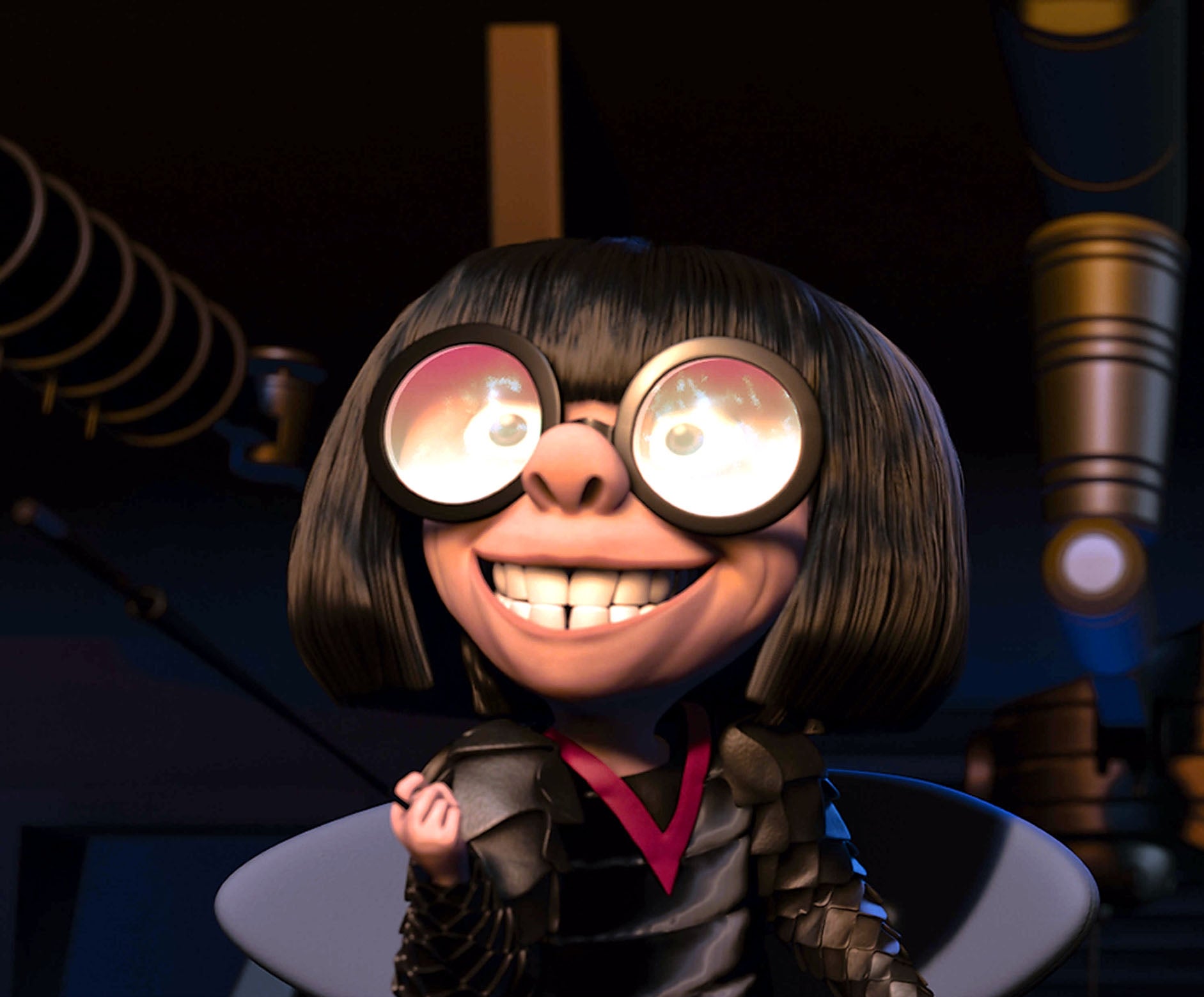 Animated characters Edna Mode and Elastigirl sit together, with Edna grinning excitedly and Elastigirl looking surprised