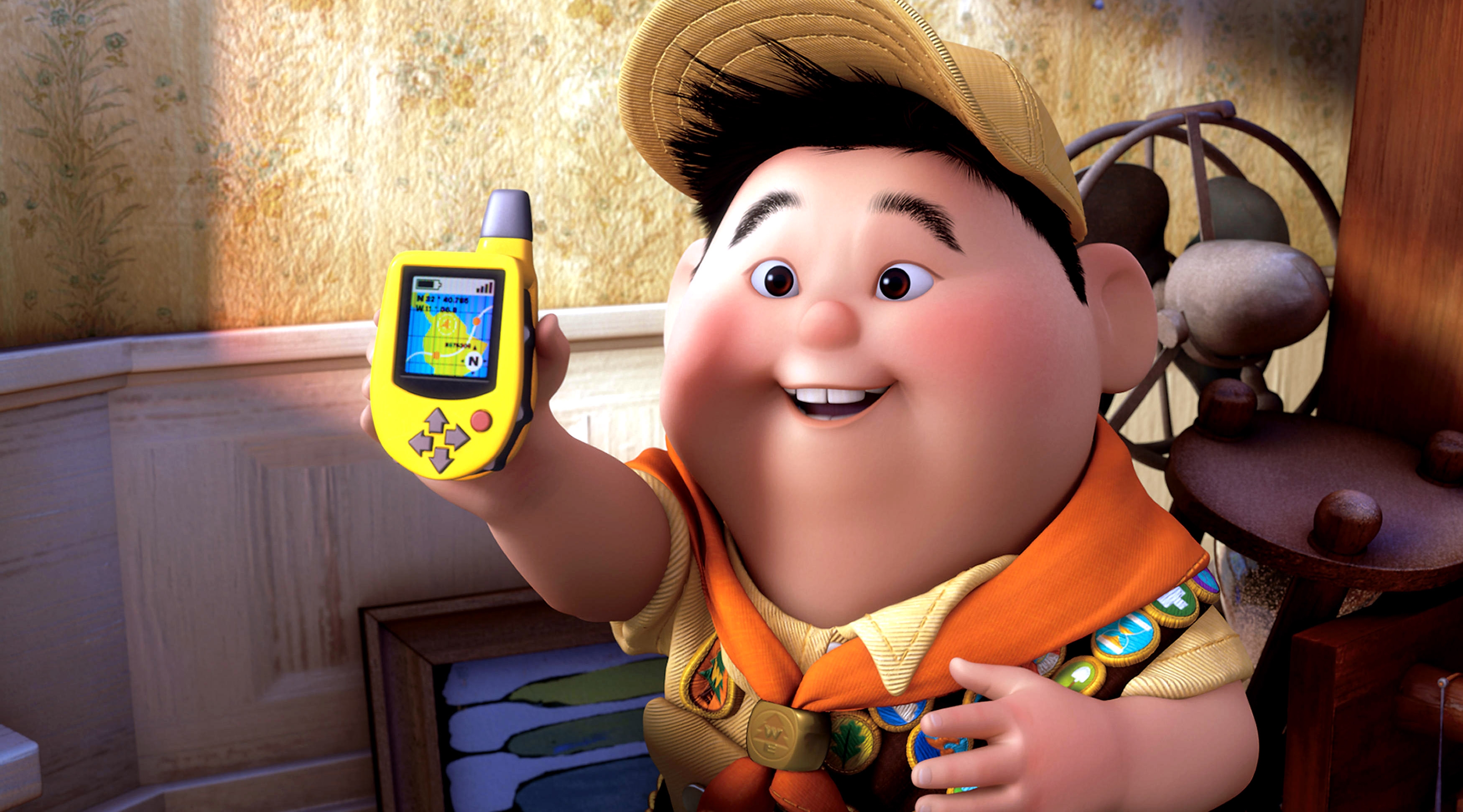 Animated character in scout uniform holding a GPS device happily indoors