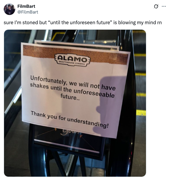 Sign on escalator says shakes unavailable "until the unforeseeable future" at Alamo Drafthouse Cinema