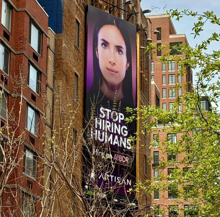 Outdoor billboard shows a humanoid face with text: "Stop Hiring Humans" and details for artificial intelligence hiring solutions
