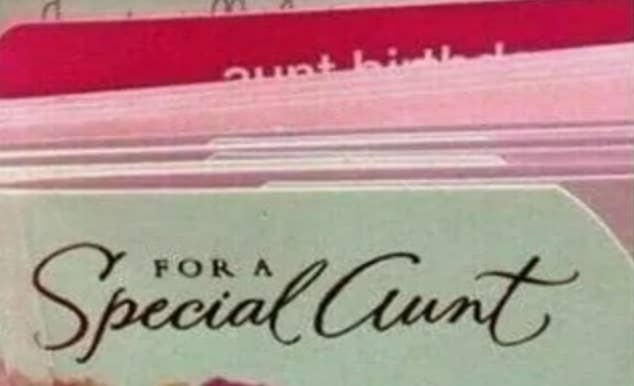 Greeting cards on a rack, with one card labeled "For a Special Aunt" in cursive script. The font makes it look like it says "for a special cunt"