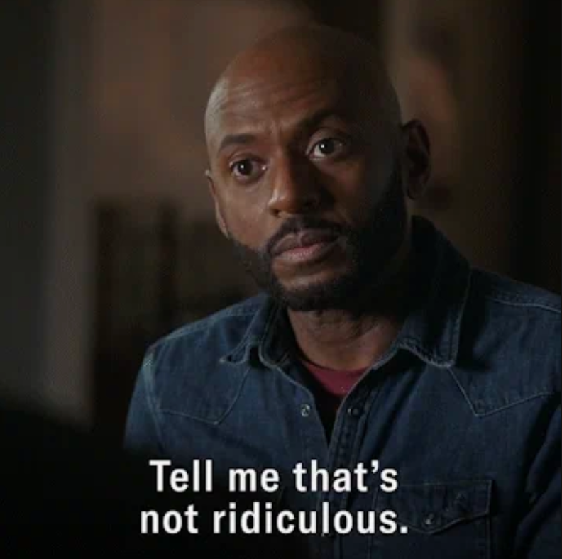 A person looks intently at someone off-camera with an expression of disbelief. Subtitles read, "Tell me that's not ridiculous."