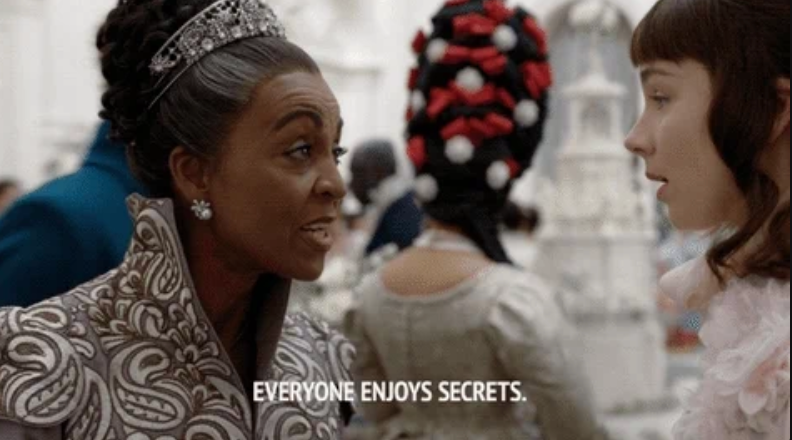 Two women in a historical setting share a conversation. Subtitles read: "Everyone enjoys secrets."