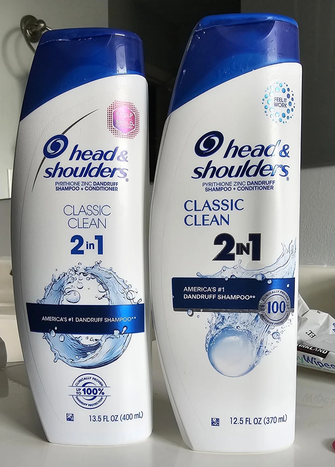 Two bottles of Head & Shoulders Classic Clean 2-in-1 shampoo and conditioner, highlighting "America's #1 Dandruff Shampoo" on the label