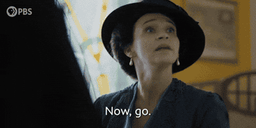A person in period clothing and a hat looks upward, appearing serious, with the text &quot;Now go.&quot;