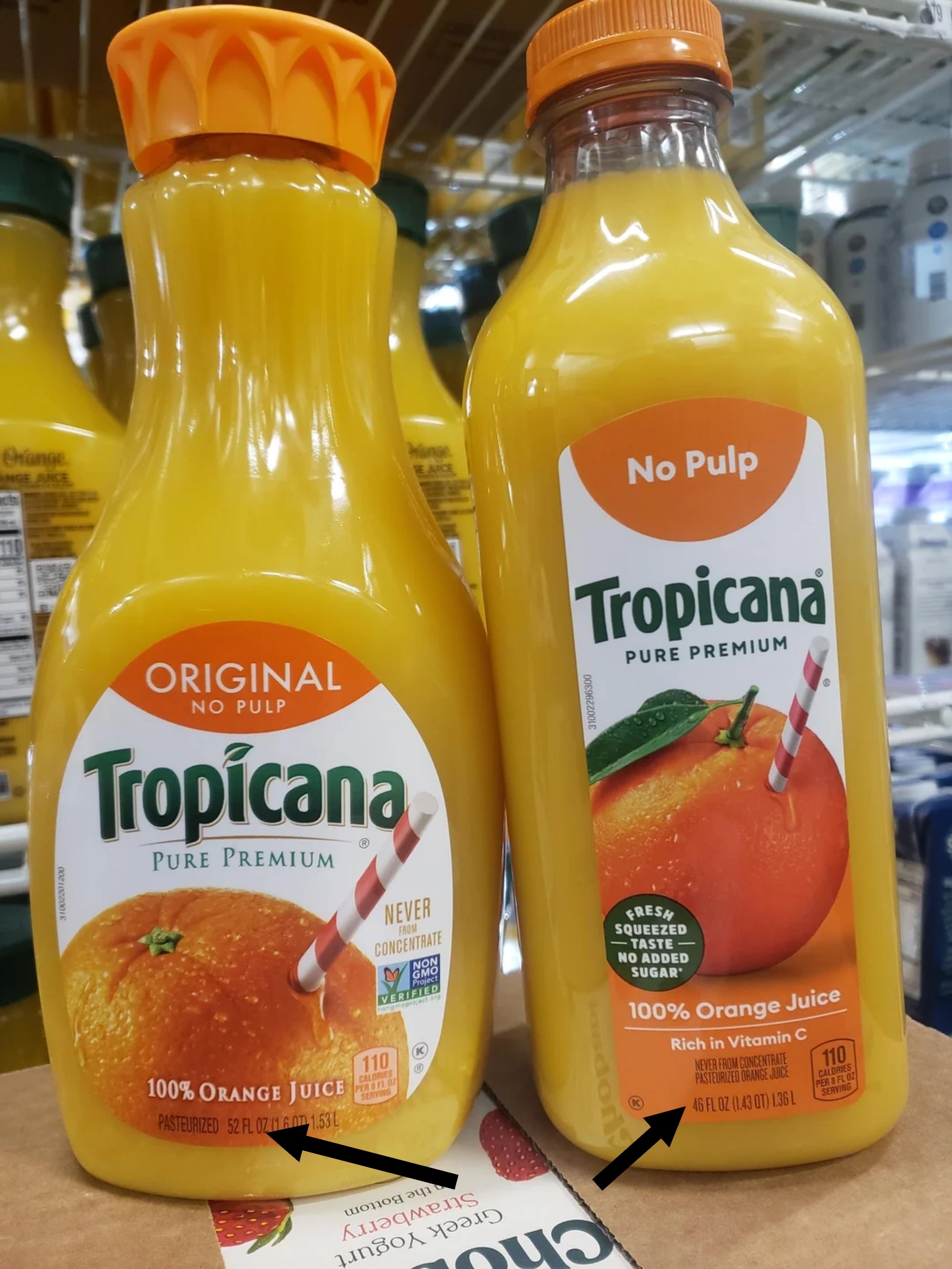 Tropicana orange juice bottles on a store shelf, labeled "Original" with "No Pulp" and "100% Orange Juice" prominently displayed. One bottle contains 52 ounces and the other 46