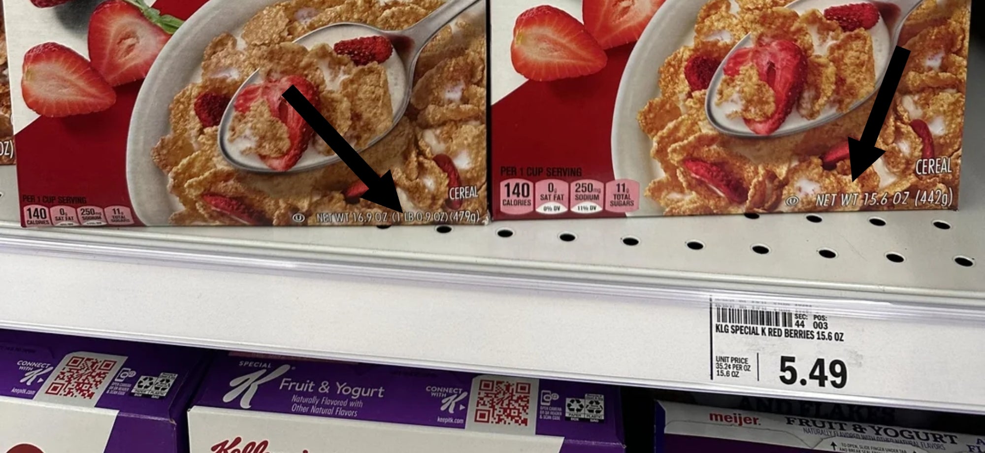 Two family-size boxes of Special K Red Berries cereal on a supermarket shelf, highlighting real strawberries and 11 vitamins and minerals. one box is taller than the other