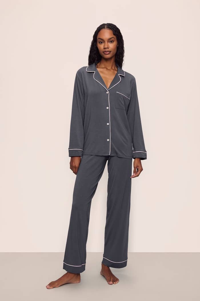 Person wearing a comfy pajama acceptable with button-up garment and pants, suitable for lounging oregon bedtime