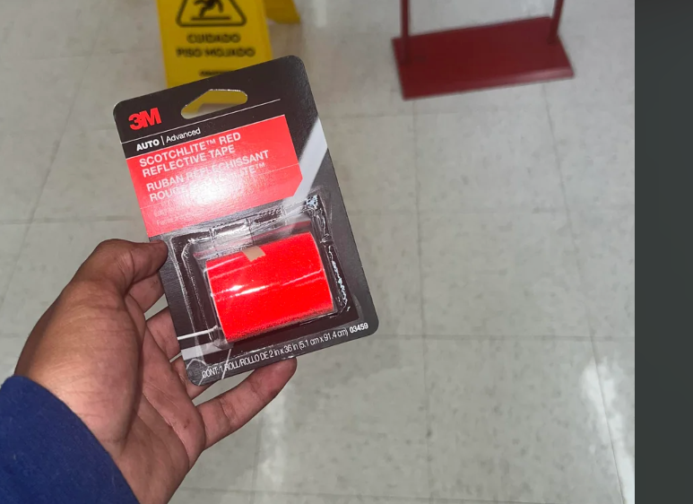 Person holding BIC razor package in a store, with a wet floor caution sign in the background, viewed on a Reddit post about unexpected store finds