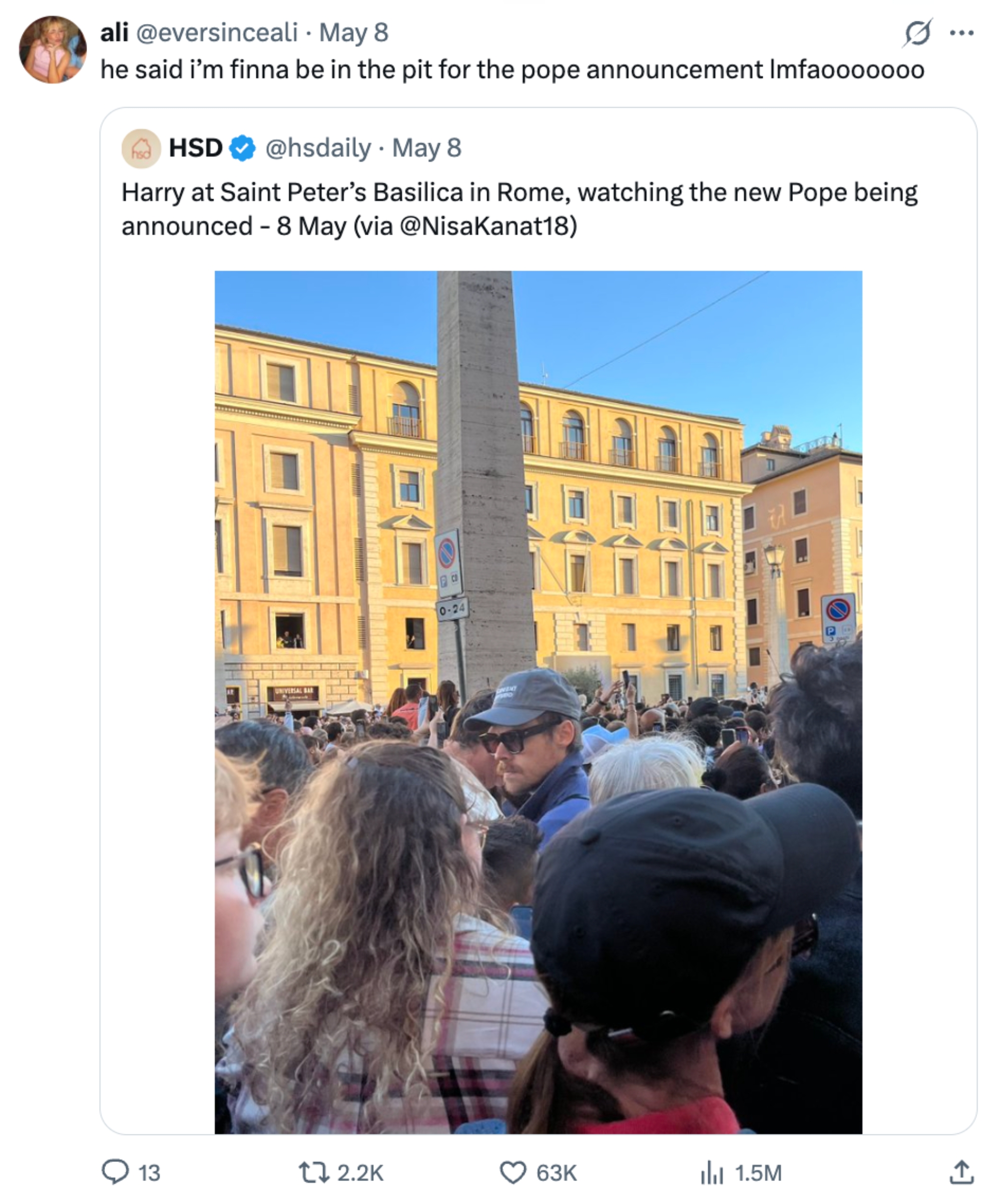 A large crowd gathers outside, some people looking upward, possibly awaiting a significant announcement