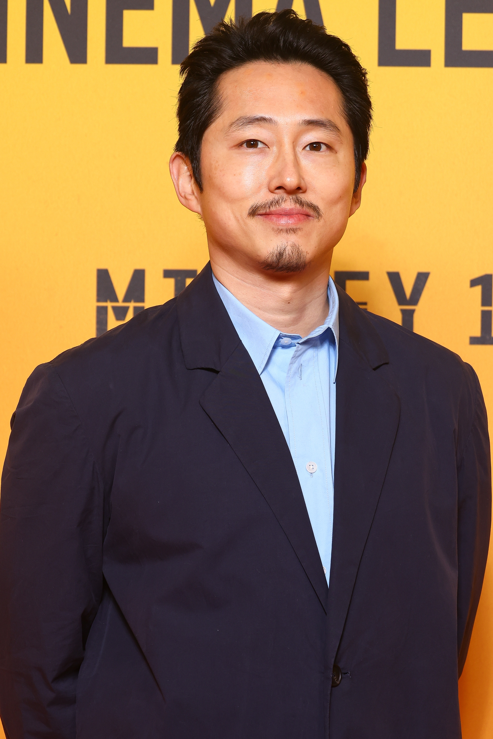 Steven Yeun on the red carpet.